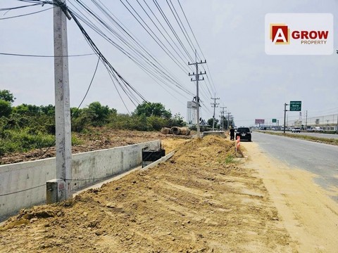 ที่ดินเปล่าถมแล้ว ติดถนนพหลโยธินขาเข้า ปากทางเข้าโรงไฟฟ้าวังน้อย .